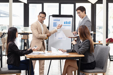 Asian business teamwork working with analysis report and advisor showing plan, Financial analysis and Marketing teamwork concept.