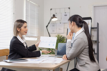 Obraz premium Two businesswoman working with analysis data investment plan, Business startup and marketing presentation,