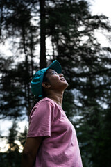 Young Indian Female hiker enjoying the breathtaking Himalayan mountains and alpine forests...