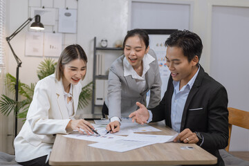 Asian business teamwork working on digital tablet with analysis report and advisor showing plan, Financial analysis and Marketing teamwork concept.