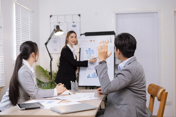 Asian business teamwork working on digital tablet with analysis report and advisor showing plan, Financial analysis and Marketing teamwork concept.