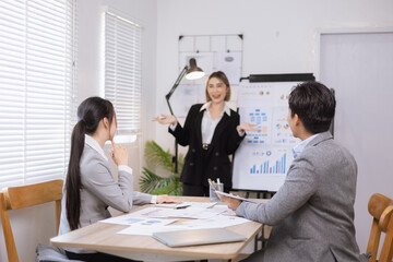 Asian business teamwork working on digital tablet with analysis report and advisor showing plan, Financial analysis and Marketing teamwork concept.