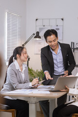 Asian business teamwork working on digital tablet with analysis report and advisor showing plan, Financial analysis and Marketing teamwork concept.