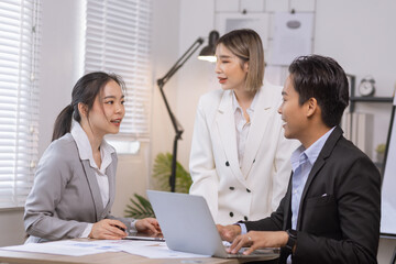 Fototapeta premium Asian business teamwork working on digital tablet with analysis report and advisor showing plan, Financial analysis and Marketing teamwork concept.