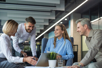 Group of happy progressive business people working on startup together at creative office