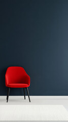 Bright red chair positioned against a dark blue wall in a modern interior design setting
