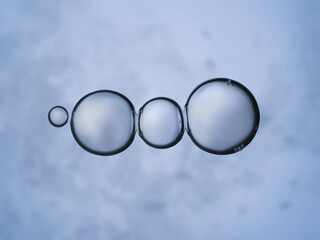 Macro close up of soap bubbles look like scientific image of cells division process, Concept of cell divides into two cells