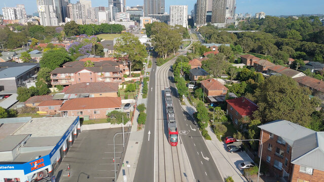 Aerial drone view of a light rail vehicle at Parramatta cbd in Western Sydney, NSW, Australia as it travels along George Street in November 2024 
