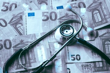 cost of health care: stethoscope on euro money