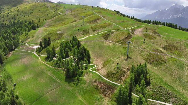 Aerial view green grass fields on Helm Mountain in Puster Valley in Italy