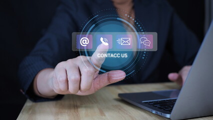 Contact us or Customer support hotline people connect. Businessman use computer keyboard and virtual screen contact icons ( email, live chat, internet wifi ).Contact us connection concept .