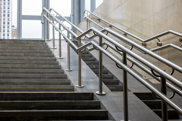 A beautifully designed set of stairs featuring a stainless steel railing
