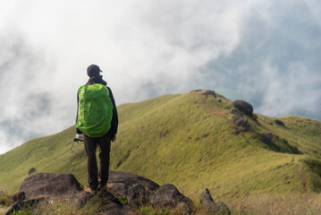 Traveler sightseeing the beautiful scenery of nature and mist during time the sunrise