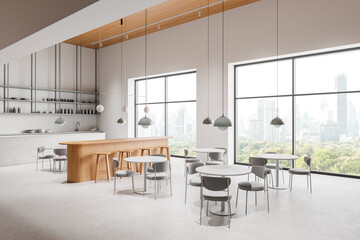 Modern cafe interior with island, dining tables in row and panoramic window