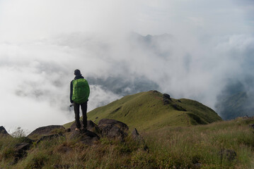 Traveler sightseeing the beautiful scenery of nature and mist during time the sunrise