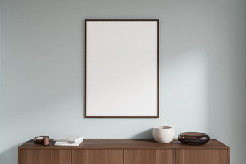 Empty framed poster on a wooden cabinet with books and decor against a light wall background. Concept of interior decor. 3D Rendering