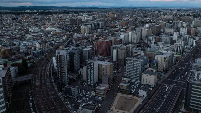 昼から夜にかけて撮影された仙台の都市風景のタイムラプス映像（ズームアウト）