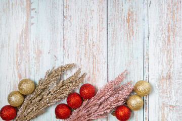 Christmas decorations on a wooden background: Christmas tree balls, branches, snowflakes and candy...