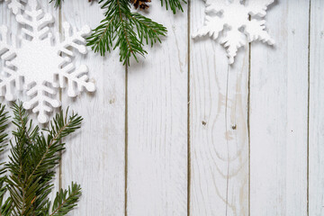 Christmas decorations on a wooden background: Christmas tree balls, branches, snowflakes and candy...