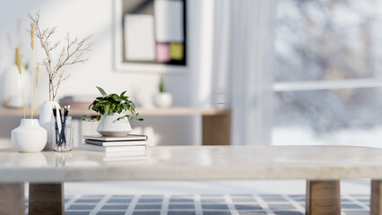A close-up of a coffee table in a contemporary white living room.