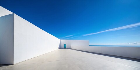 Minimalist White Wall Against Blue Sky: High Angle View of a Contemporary Architectural Design Showcasing Clean Lines and Tranquil Aesthetic for Modern Home or Office Spaces