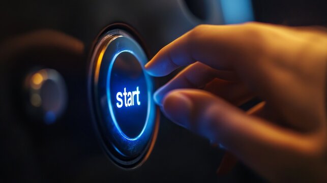 A person is pressing a button that says start - Powered by Adobe
