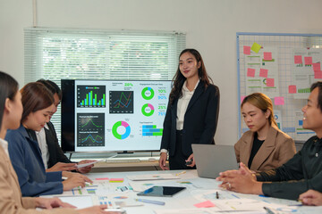 Asia business group meeting and discuss new startup concept projects Business team planning, strategic analysis and brainstorming with office paper reports.