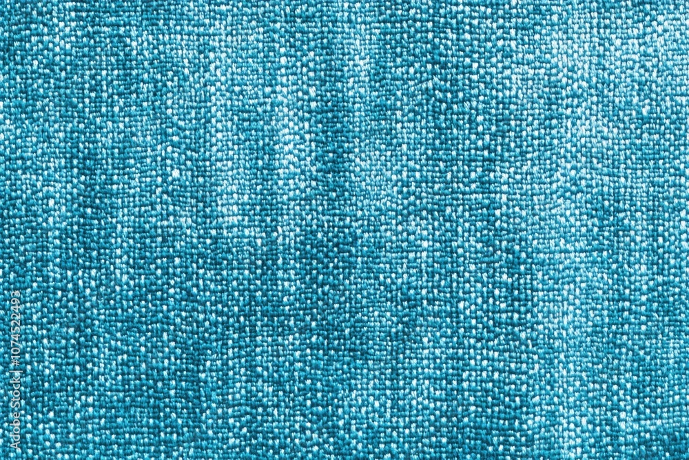 Poster close-up shot of a blue cloth with intricate stitching and pattern