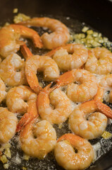 Roast Prawns Shrimps in a pan with herbs and garlic. Isolated. Top view. High quality photo