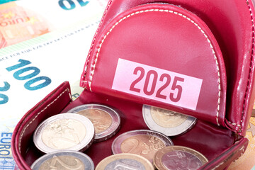 A wallet, euro banknotes and a forecast for finances in 2025