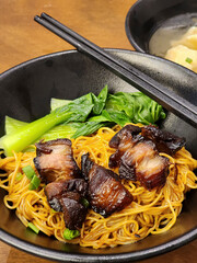 Popular Chinese meal. Dried Wanton Noodle with Iberian Char Siu and Wanton Dumplings. Grilled pork...