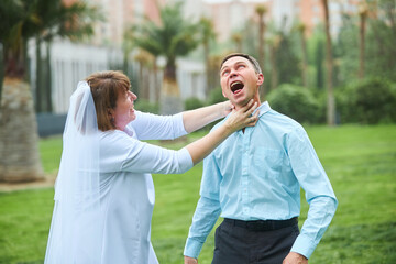 An adult bride and groom. Husband and wife photo shoot for the 30th wedding anniversary. An...