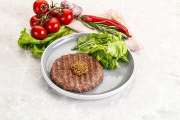 Frilled beef burger cutlet with iceberg