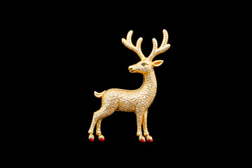 Obraz premium Gold brooch in the shape of a deer. 