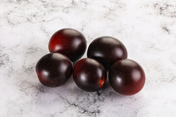Raw ripe black kumato tomato
