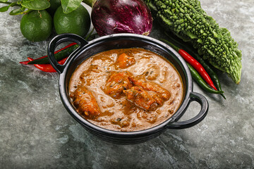 Indian cuisine - chicken curry with spices