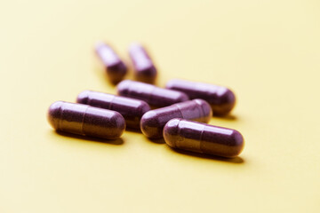 Lutein capsules. Dietary supplement on bright background. Soft focus. Close up. Copy space.