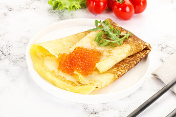 Russian pancake with red caviar