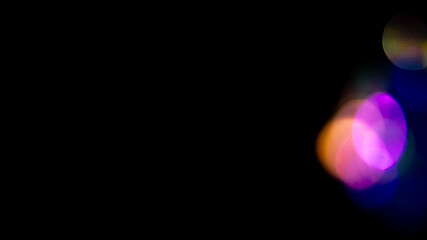 Multicolored highlights on a black background. for overlay to create a festive, vibrant effect