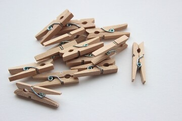 Isolated wooden clothes pegs, stationery and photo, wooden pegs on white background