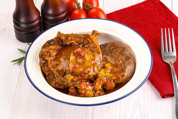 Italian cuisine - ossobuco with sauce
