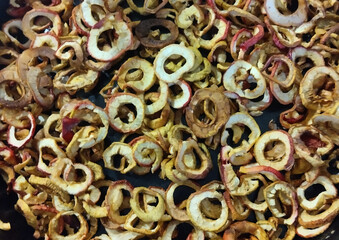 Dried apples in rings on a black background