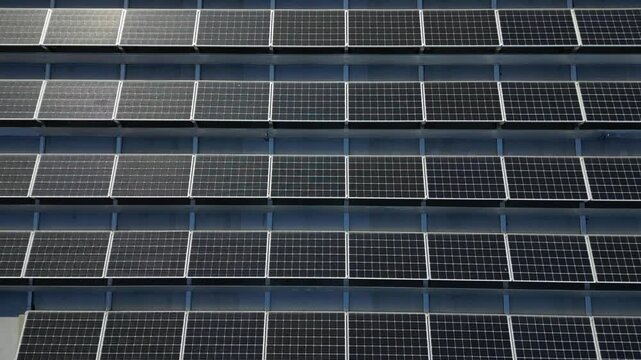  extensive roof of industrial and logistic hall are gradually being filled with solar panels. covering roofs helps industrial developer increase energy efficiency and sustainability site, building 