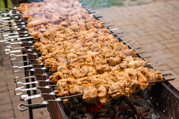 Tasty pork is cooked on the grill