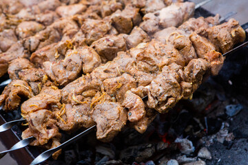 Tasty pork is cooked on the grill