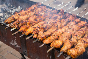 Tasty pork is cooked on the grill