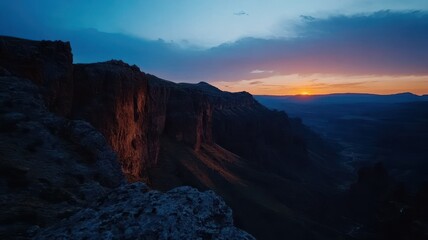 Naklejka premium Unforgettable Canyon Bathed in Dramatic Shadows and Light: Nature's Majestic Masterpiece