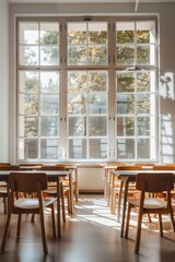 Fototapeta premium Empty classroom with simple desks and chairs, prepared for new students