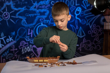 Boy engaged in building a toy structure, reflecting early interest in design and architecture. Suitable for themes of child development and STEM activities.