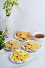 Crispy Bakery Cookies,  Almond, Butter, and Coconut Variety with a cup of tea